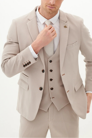 Beige suit with a white shirt and black buttons on a white background
