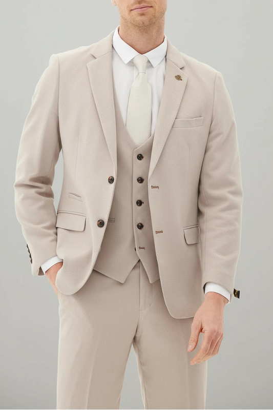Man wearing a beige suit with a white shirt on a gray background 692