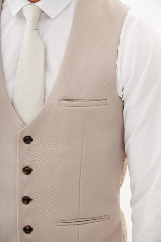 Beige vest with buttons on a white shirt background